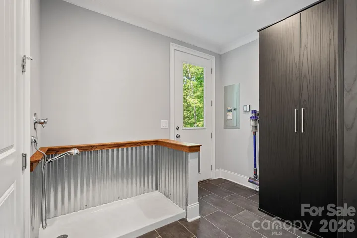 Custom Pet washing station and California closet storage. 