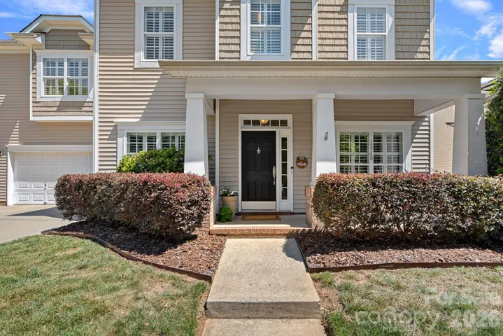 Covered rocking chair front porch...straight out of a Hallmark Movie. 