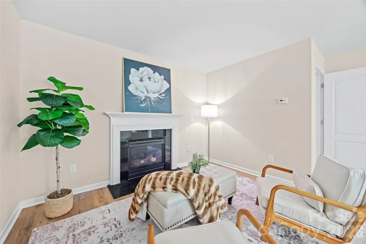 Large Primary Bedroom w/ seating area and fireplace