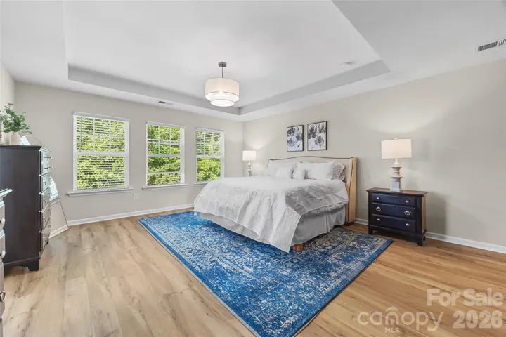 Large Primary Bedroom w/ seating area and fireplace