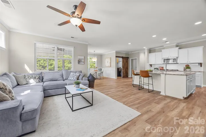 Large family room w/ fireplace - perfect for entertaining or movie night! 