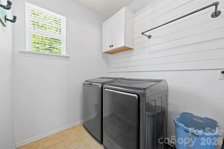 Main level laundry room w/ barn door detail