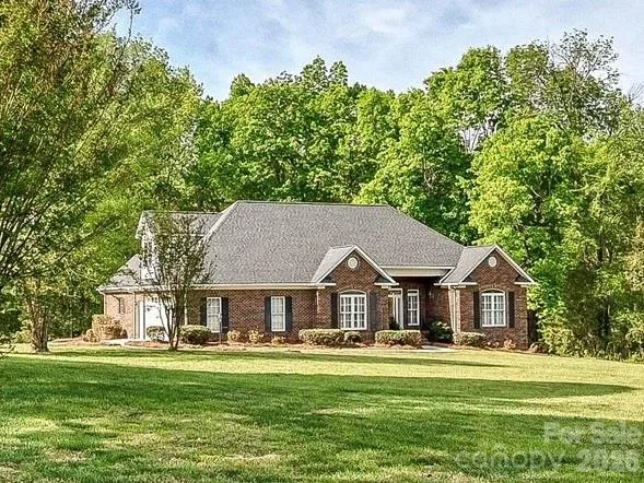 Custom brick ranch on 4+ acres!