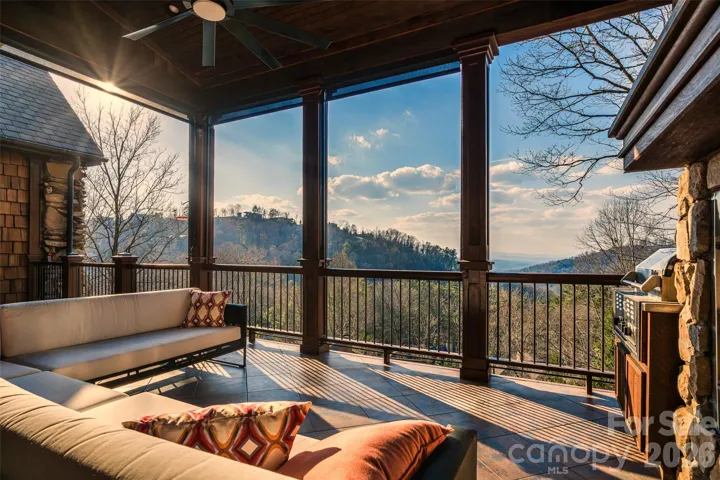 Awesome covered back porch on main level to soak up the views