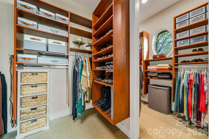 Walk-in closet in primary bedroom suite