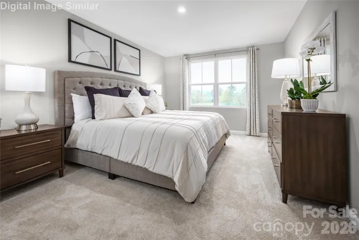 Your private escape awaits—this spacious owner’s suite features a luxe bath and an oversized walk-in closet for ultimate comfort and convenience.