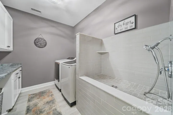 Laundry Room with dog washing area.