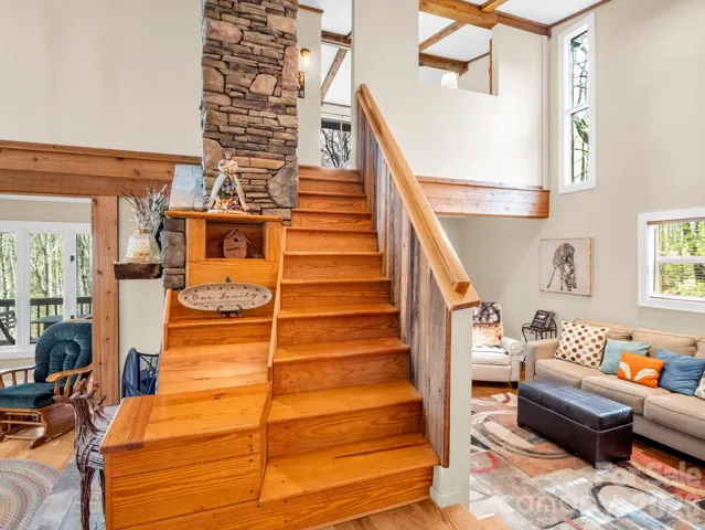 Main level view showing stairs to upstairs and family room to the left