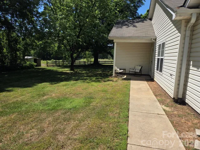 Front entrance to duplex with large yard