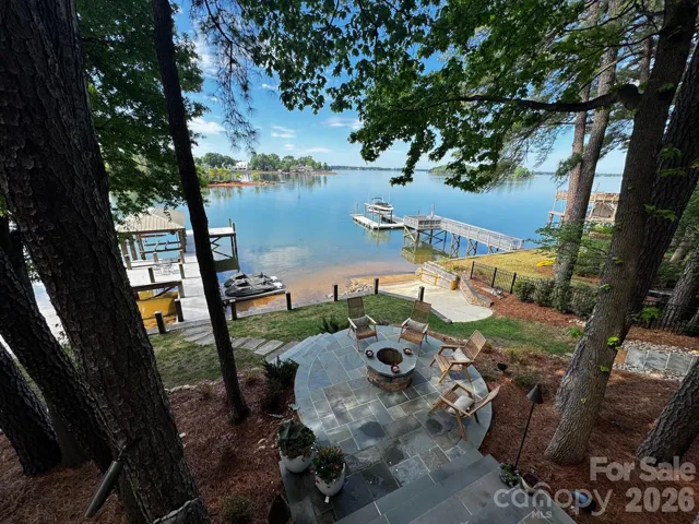 Long-range Waterfront views from the main level of the home or waterside patio fire pit seating offering total relaxation.