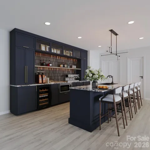 Rendering of basement bar featuring custom cabinetry, microwave, sink, beverage & wine fridge and freezer. 