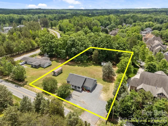 Lot lines are approximate. The lot to the left recently sold and a new build is planned through Classica Homes. To the right is River Run, whose community sidewalk can be accessed from the back right corner of this lot.