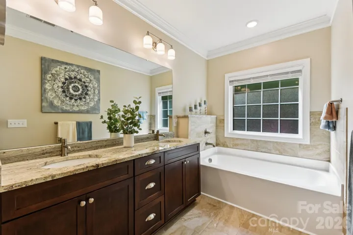 Primary bath with 2 basin vanity and soaking tub