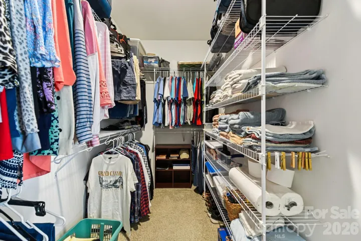 Spacious walk in closet in primary