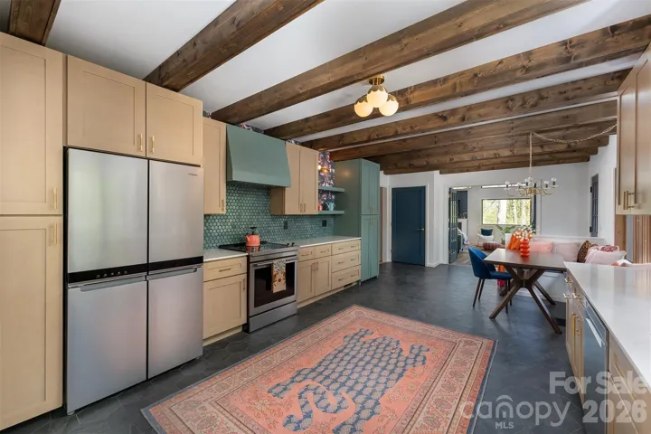kitchen with custom stove hood and rollouts