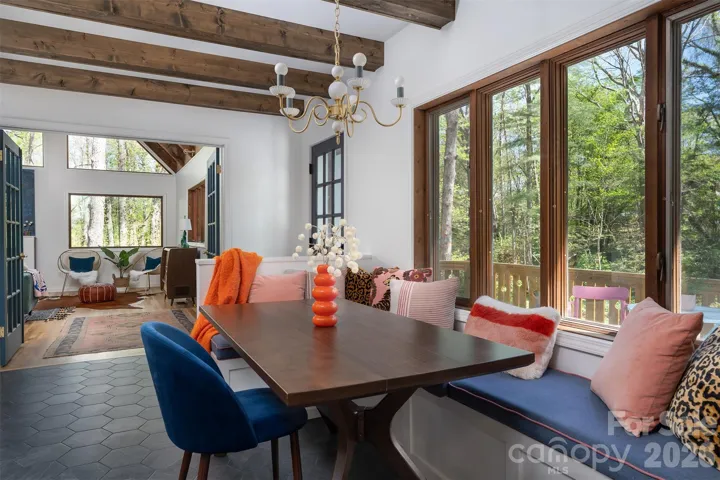 Built in banquet seating, exposed beams and tile floor