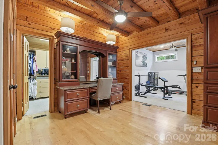 Changing room with walk in closet, 2nd closet and work out room with door that leads to the sun deck on back of home.
