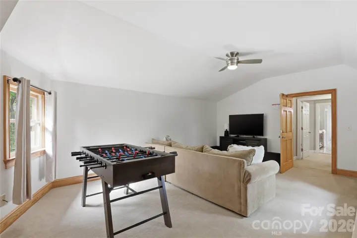 Living / game room that leads to 2nd living quarters.