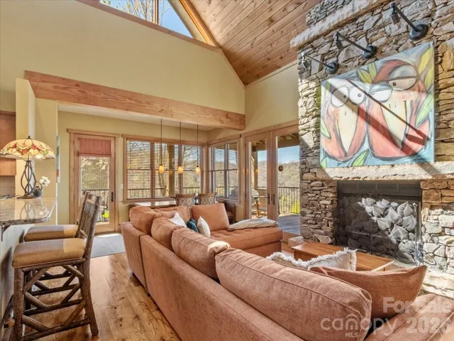 Floor to ceiling stone fireplace.