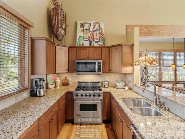 Granite countertops and SS appliances.