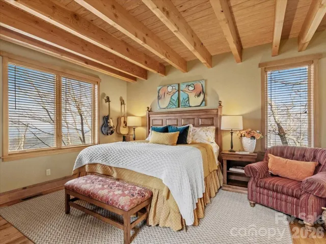 Primary bedroom with hardwood floors.