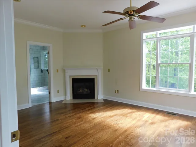 Primary Bedroom is filled with natural light.