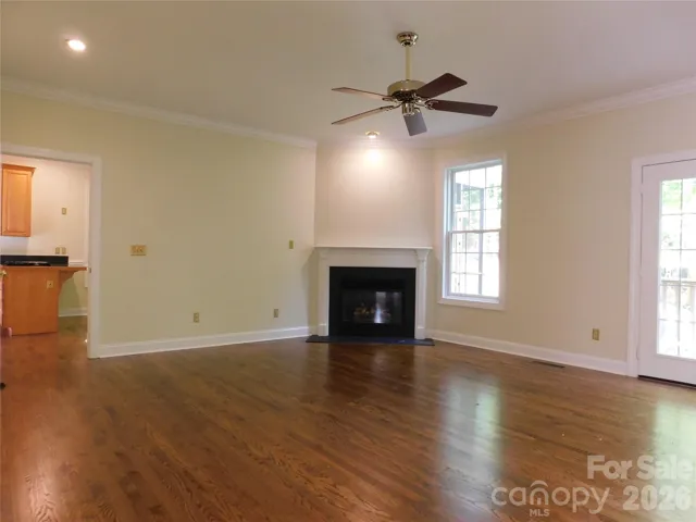 Corner fireplace adds warmth and ambiance to main level living room.