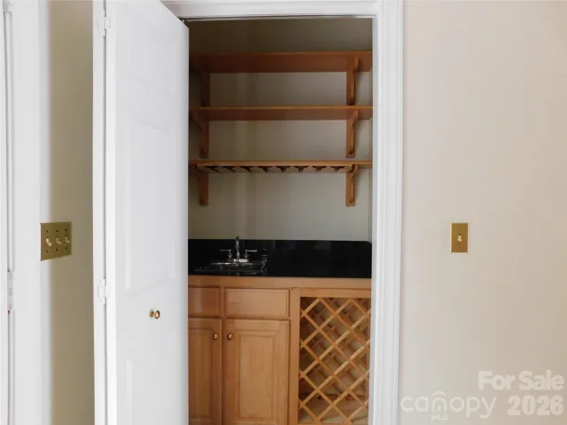 Conveniently located, wet bar makes entertaining easy.