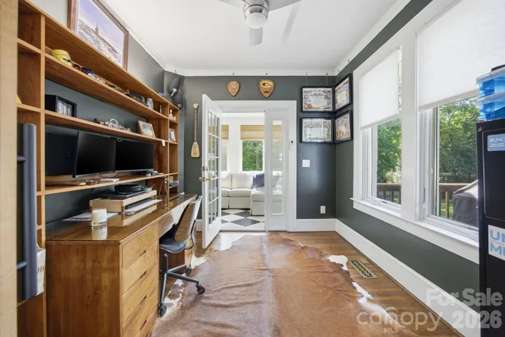 Office with built ins and doors for privacy