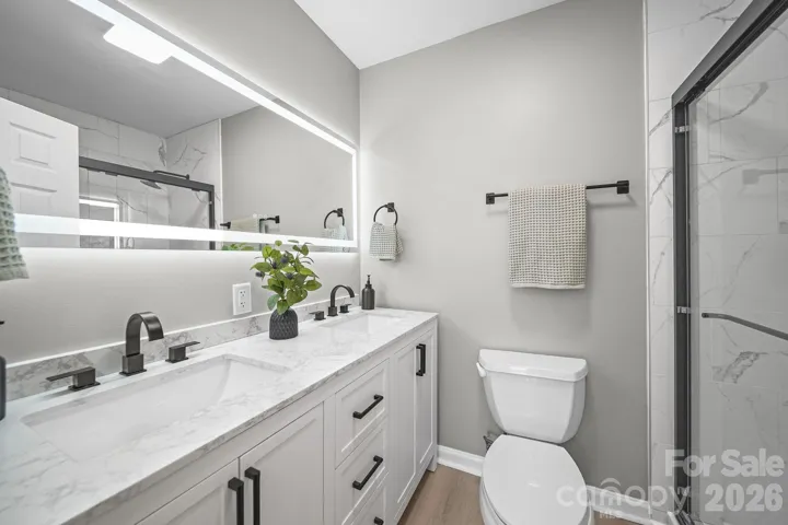 Primary bathroom with double sinks and beautiful shower