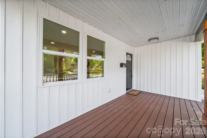 Covered front porch, perfect for morning coffee time.