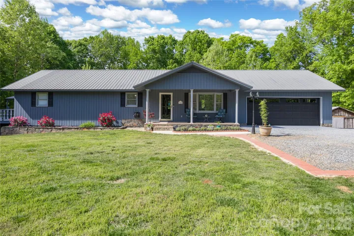 Front of home with walkway to covered porch