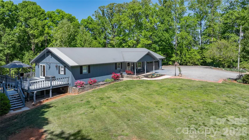 Front of home with large deck off of primary