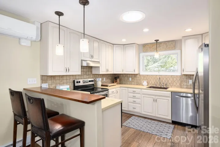 Kitchen Includes Cherry Breakfast Bar