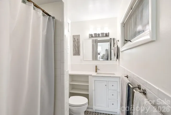 Ensuite Bath Features an Updated Vanity and Walk-In Shower