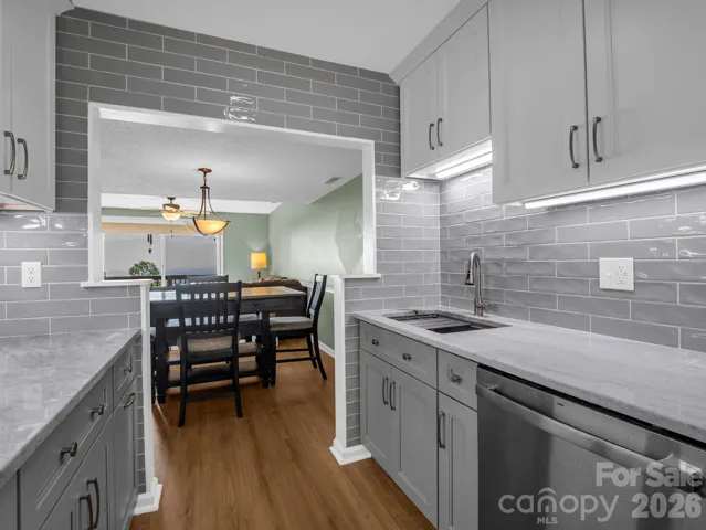 Kitchen opens to the Dining Area and Living Room