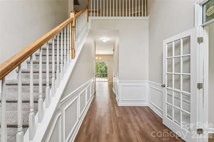 2 story foyer and fresh LVP flooring