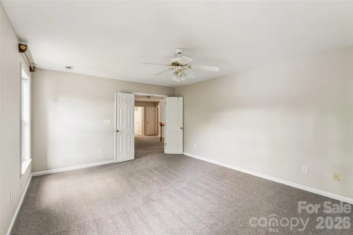 Upstairs bonus room beside primary bedroom