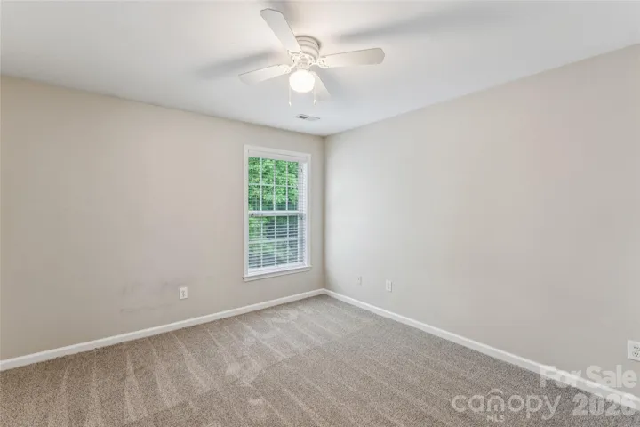 Secondary bedroom with backyard view