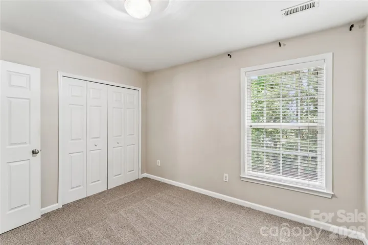 Secondary bedroom with backyard view