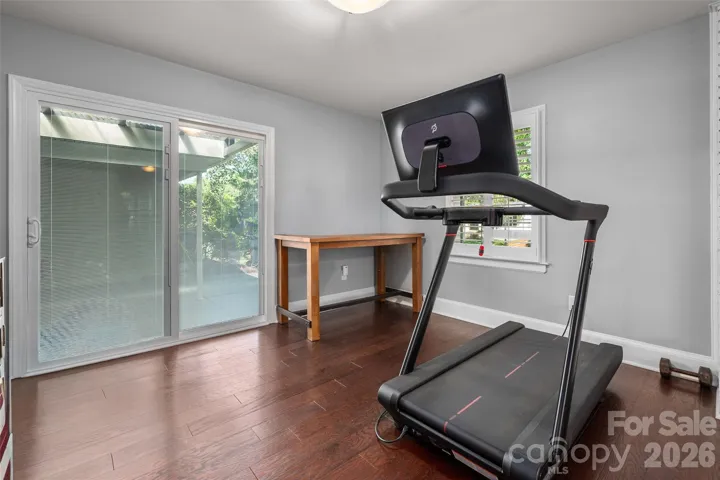 Den area with exercise equipment