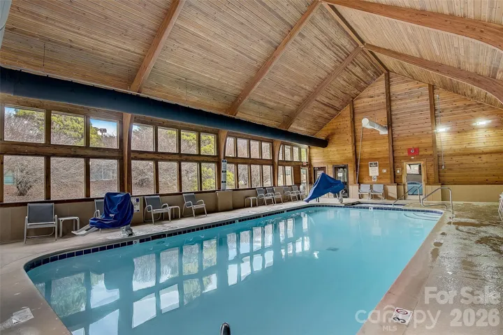 Indoor pool with hot tub, steam room, and sauna.