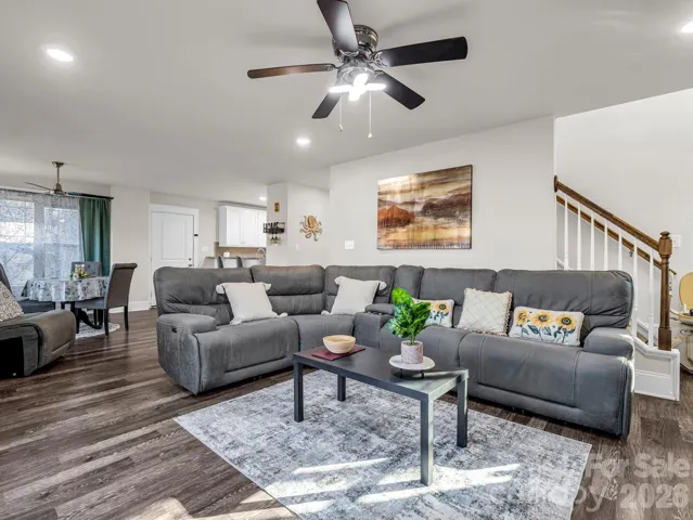 Open plan living room with a chairlift to access 2nd floor.