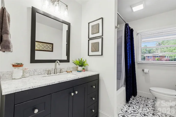 Hall bath which also has a tiled tub surround