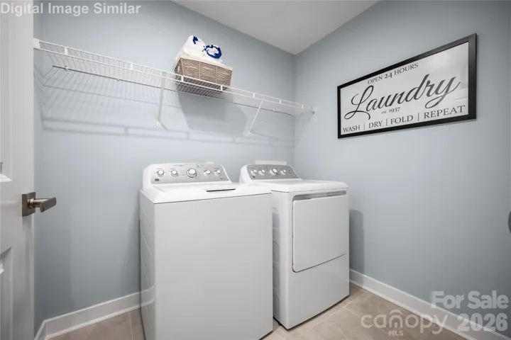 Laundry Room You'll Love.  Whether You're Sorting, Folding, or Tackling a Mountain of Towels, the Layout is Built for Efficiency.