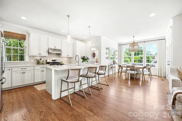 Beautifully appointed kitchen with large island and breakfast nook