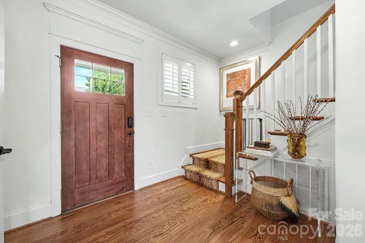 Beautiful bright foyer with hardwood flooring