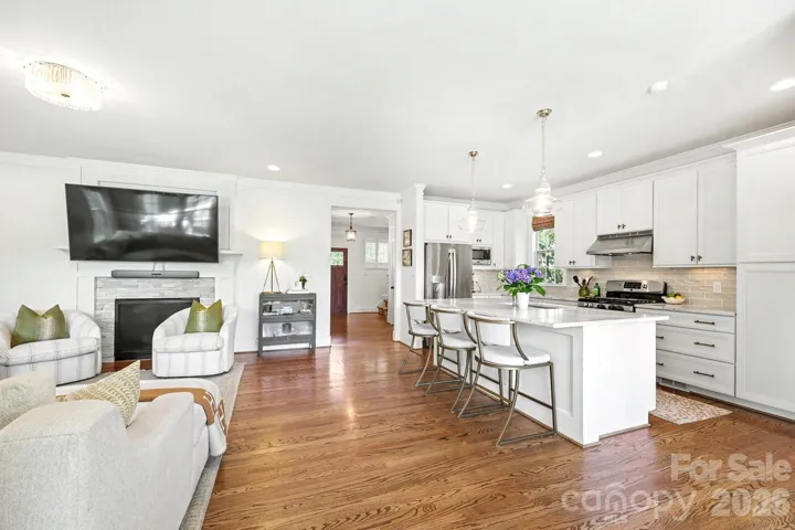 Family room with gas fireplace and open to the kitchen for entertaining. 