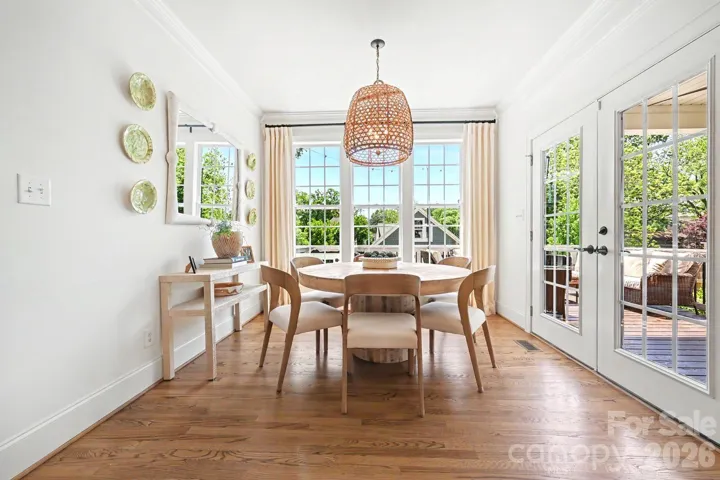Sunny breakfast room with custom lighting 