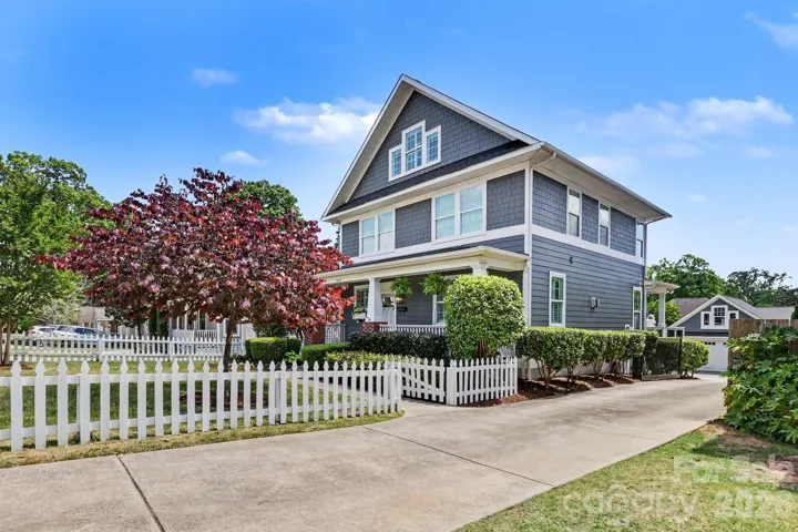 A white picket fence is the perfect way to enjoy the front of the home. 